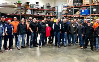 foreman pose for photo in workshop warehouse