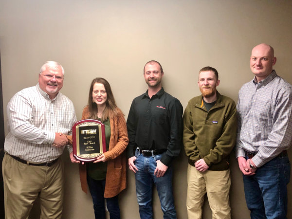 enigineering team receives award from TGW representative