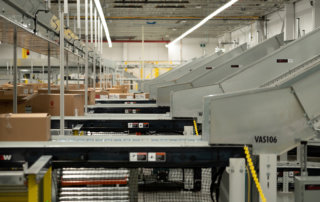 fulfillment center for Levi Strauss Toronto sortation material handling system integration conveyor close up