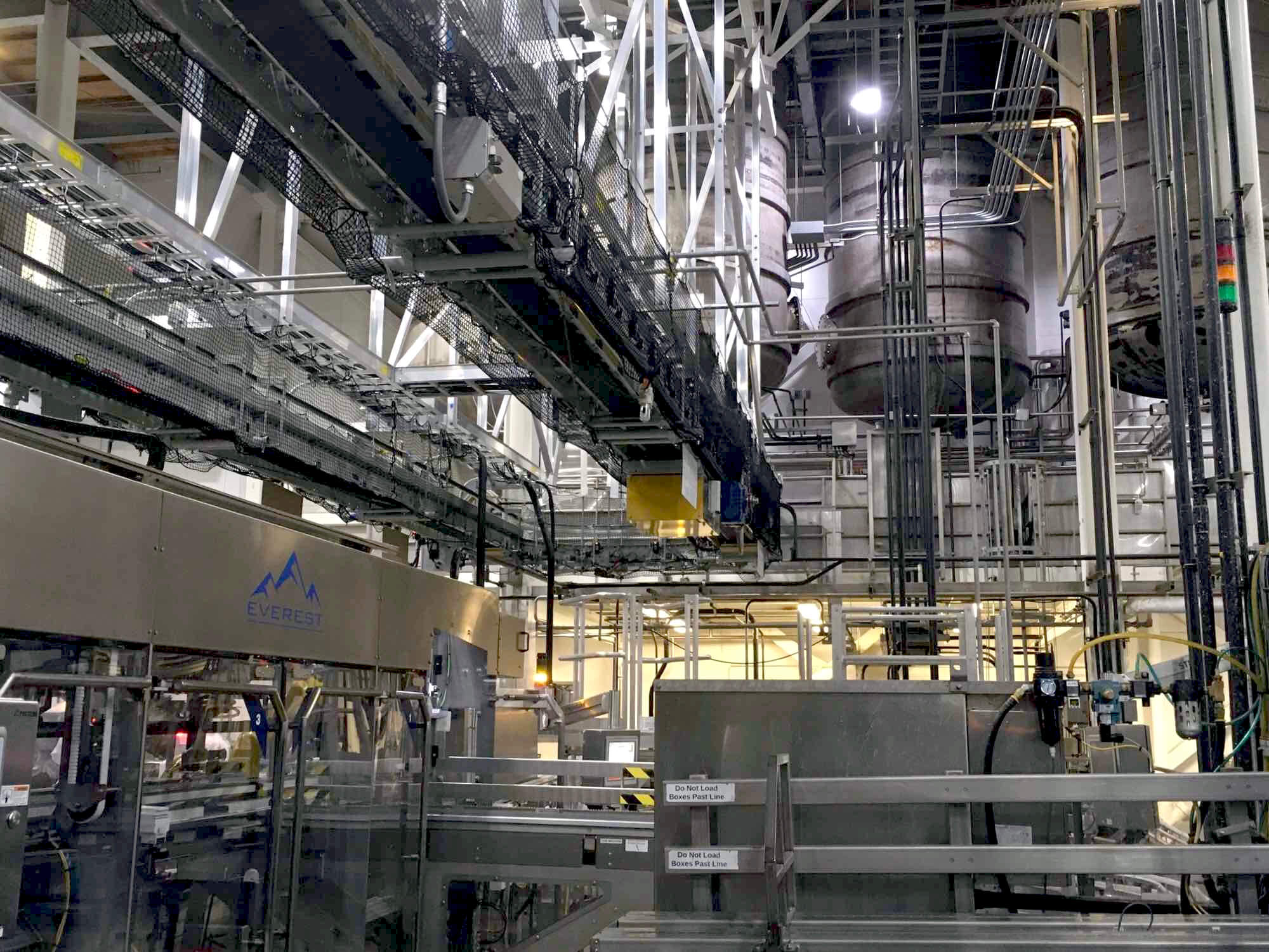 overhead conveyor for new bottling line for beverage producer