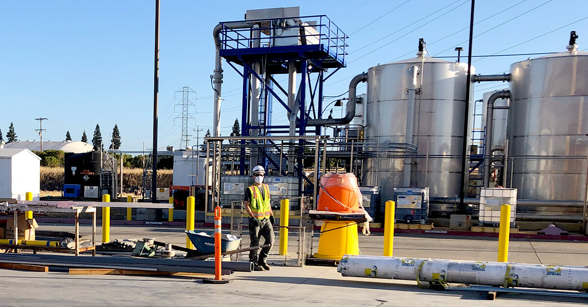 construction worker with mask on job site