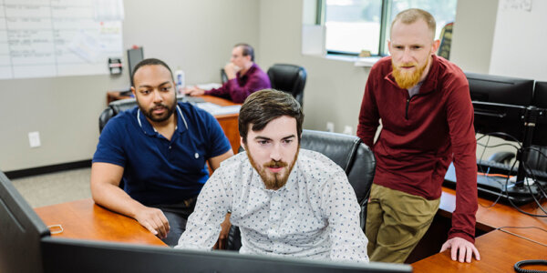 engineers working on material handling system design