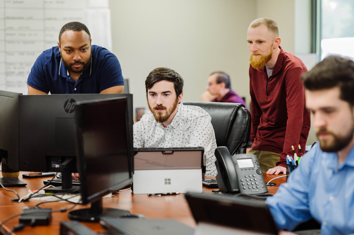 mechanical engineers working a conveyor system implementation