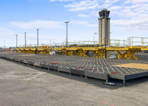 caster deck in foreground of newly construction truck deck at air cargo terminal