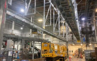 overhead conveyor installation at beverage facility
