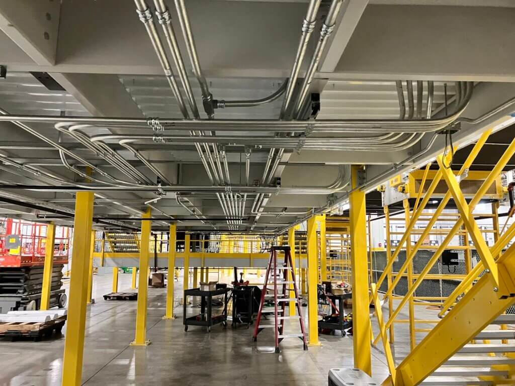 steel structure and conduit for automated parcel sortaton system