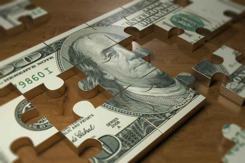 $100 bill pictured as a puzzle