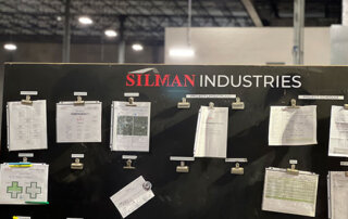 project control board on industrial job site