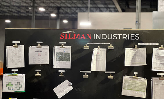 project control board on industrial job site