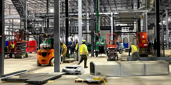 millwright team during installation of conveyor system for parcel carrier