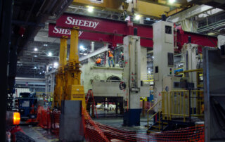 rigging and mnoving large equipment during auto plant wind down