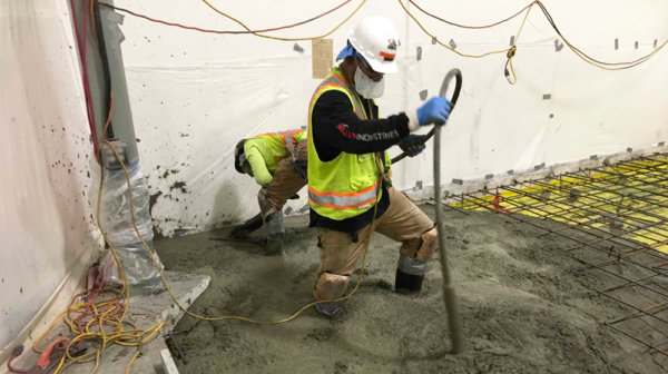 concrete construction workers with masks