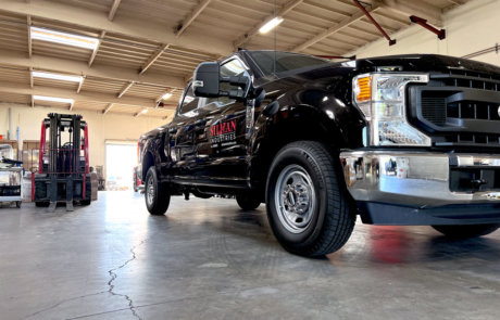 construction company pick up truck in shop