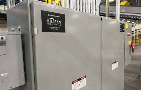 silman industries logo on electrical controls panel in parcel handling facility