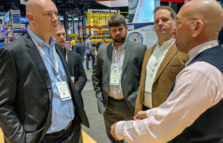 team members at an event during the promat 2023 trade show