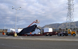 OTR trucks transporting auto plant equipment