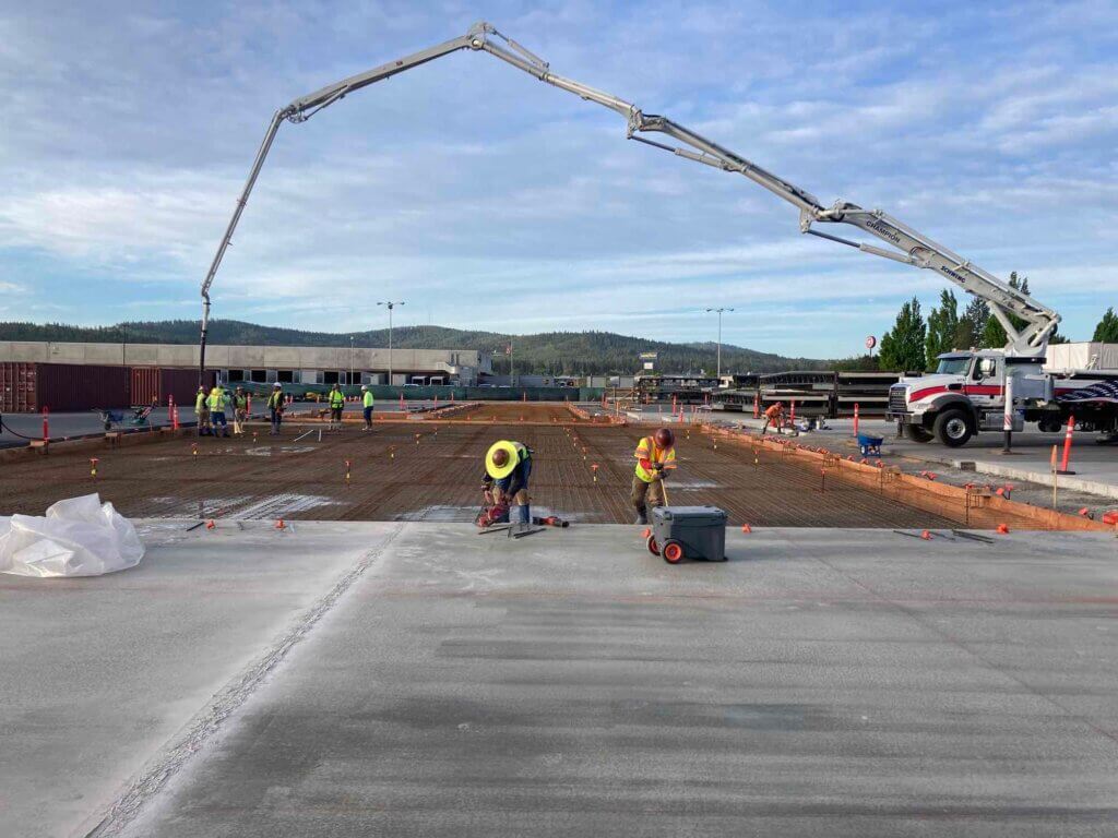 SilMan civil construction team pouring concrete foundations for a 90-day distribution center project.